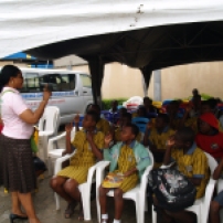 Children being advised and lectured at a training of GHAF.